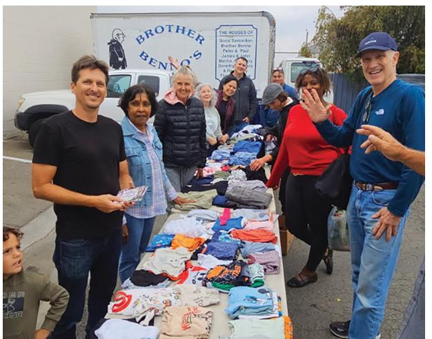 Picture of volunteers from Grace Chapel sharing donated cloting